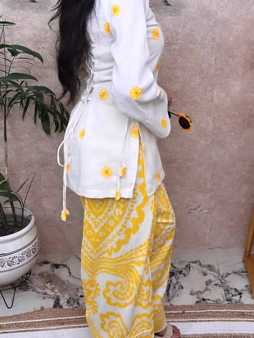 Radiant Ivory White Short Kurti Adorned with Sunshine Yellow Embroidery Paired with a Flowy Patterned Farshi Salwar